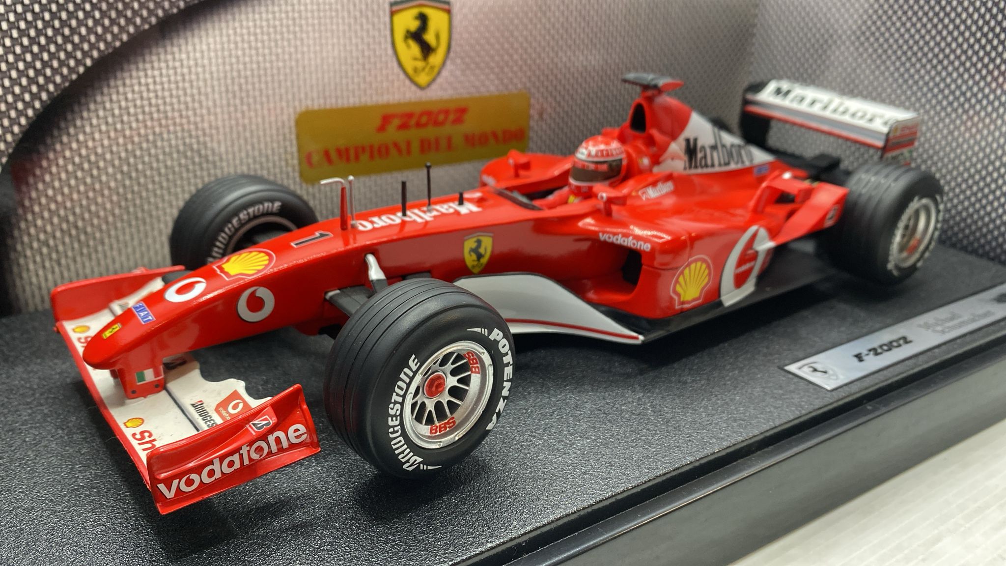 A collectible scale model Ferrari F2002 from Hot Wheels F1